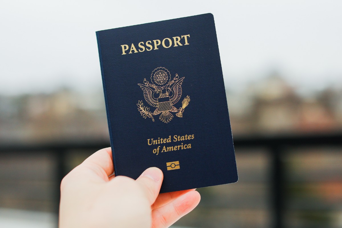 Someone holding out their US passport