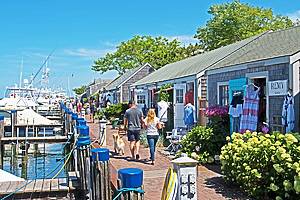 Nantucket, Massachusetts/USA - August 9 2019: a row of eclectic stores can be found next to the harbor in Nantucket.