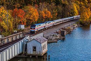 Amtrak train through fall foliage