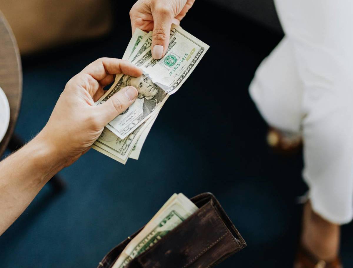 Two people exchanging cash