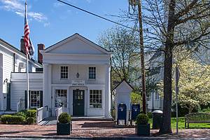 Bedford, NY, USA-May 2022; View from the Village Green towards the historic buildings amongst which the US Post Office