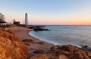 Beautiful sunset of New Haven Light House, Connecticut, USA. The lighthouse is dark, but the tower remains, greeting ships from around the world to New Haven.