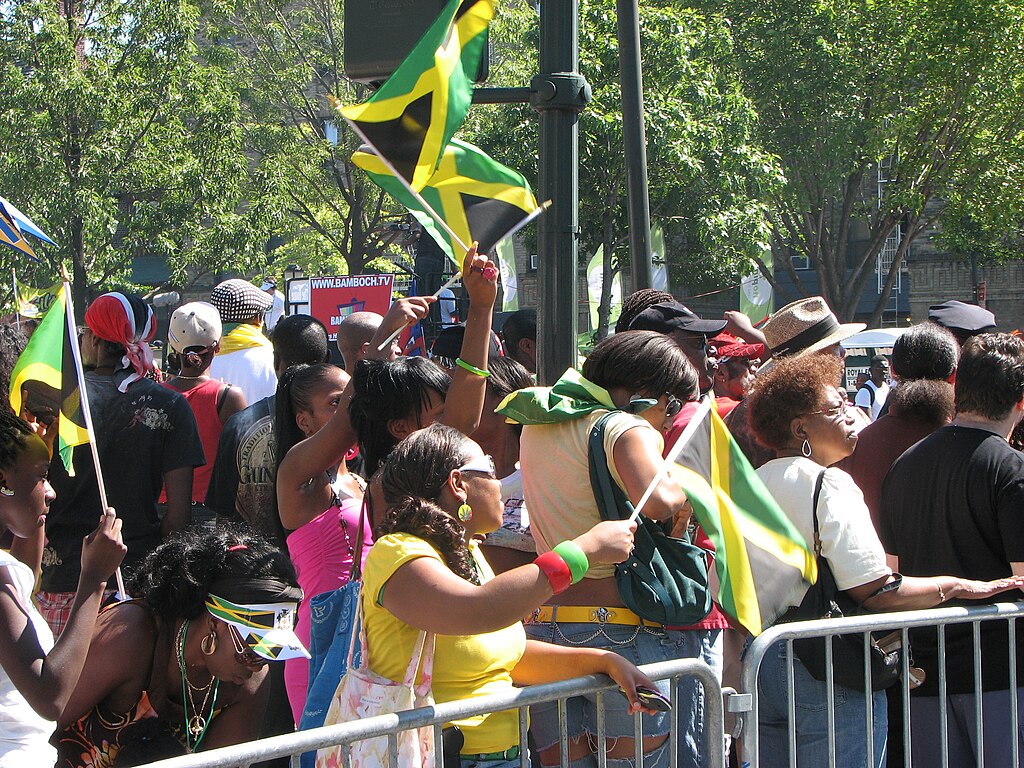 West Indian Day Parade goers waving Jamaican flag