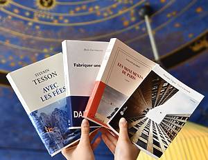 person holding books
