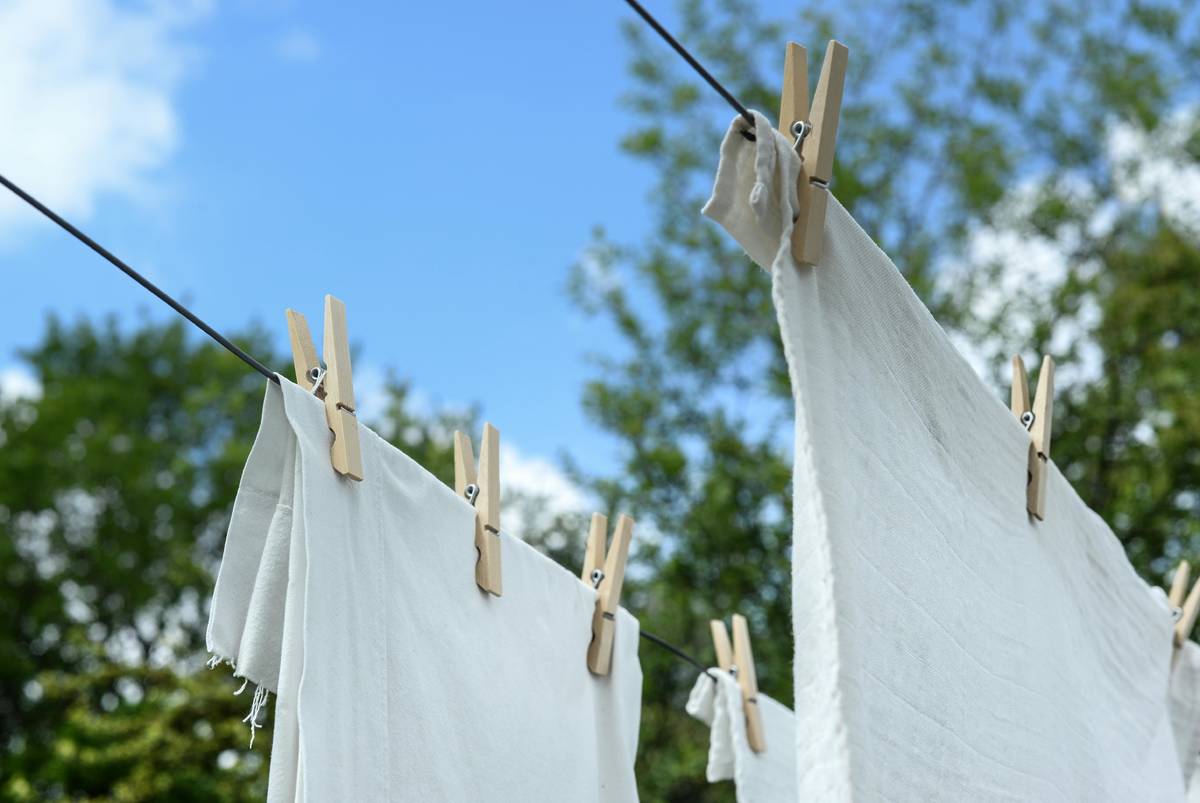 White linens drying on a clothing line