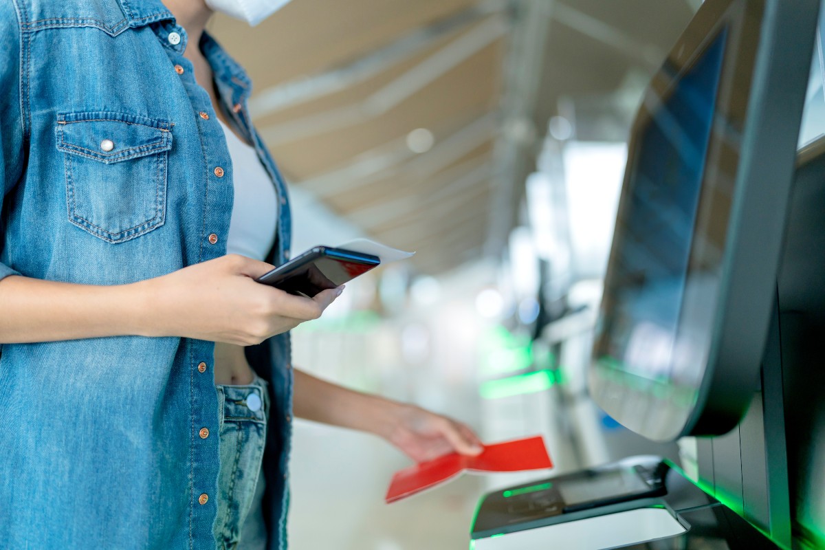 Women scanning passport at airport