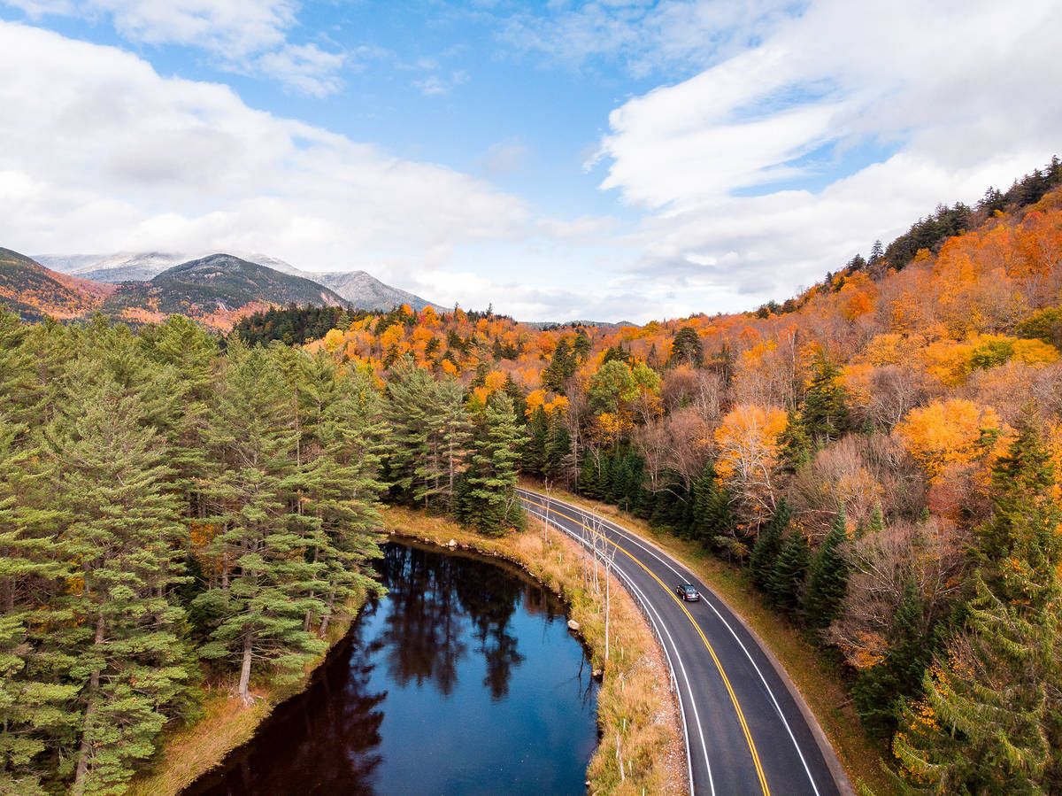 Aerial view of High Peaks Scenic Byway and a body of water