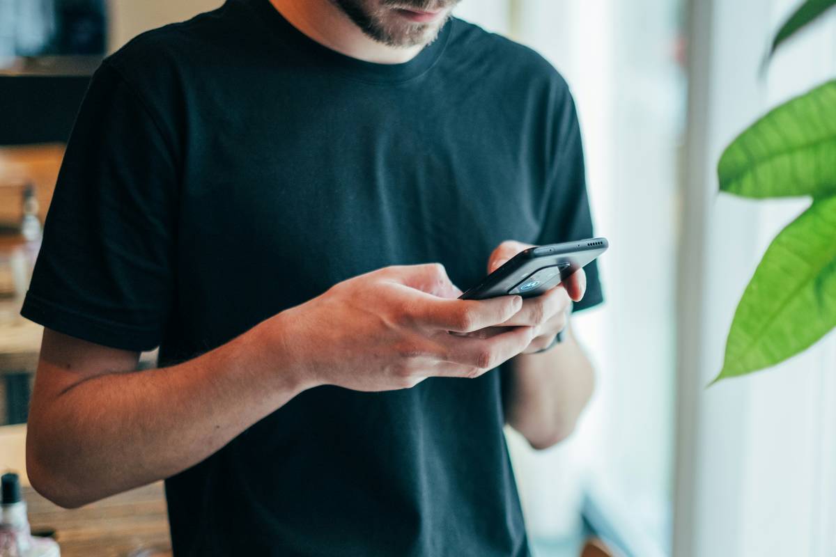 Man typing on his phone