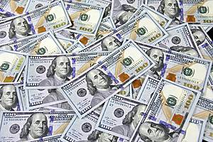 pile of hundred dollar bills