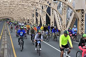 New York City, USA, - May. 4. 2014: people going up Queensboro Bridge at Five Boro Bike Tour, New York, USA