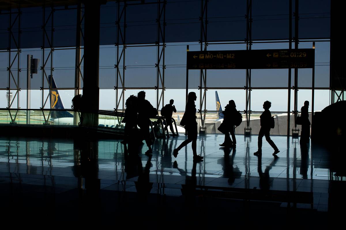 People moving through an airport