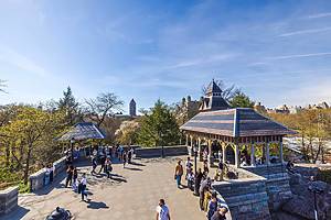 Beautiful view of Belvedere Castle in Central Park, New York City, where people admire the landmarks on a sunny spring day. NY.USA. 04.14.2024.