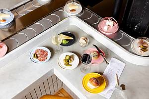 assortment of plates and cheeses at Pick & Cheese, London-based cheese conveyor belt restaurant opening in Shaver Hall