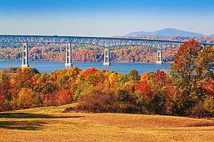 Landscape with Trees in Autumn Colors, Kingston-Rhinecliff Bridge, Hudson River, Catskill Mountains and Blue Sky in Background, Hudson Valley, New York, USA. Canon EOS 6D Full Frame Sensor Camera, Canon EF 70-200mm F/4L IS lens.