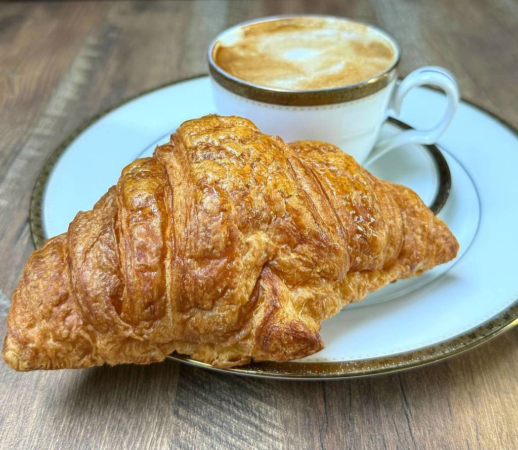 Coffee and a croissant from plant-based bakery Photo: Délice de Bernay in the West Village, NYC.