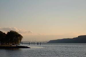 The New York City skyline, George Washington Bridge, and the Hudson River as seen from Dobbs Ferry, New York, USA in November.