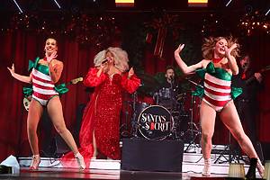 Performers wear holiday costumes