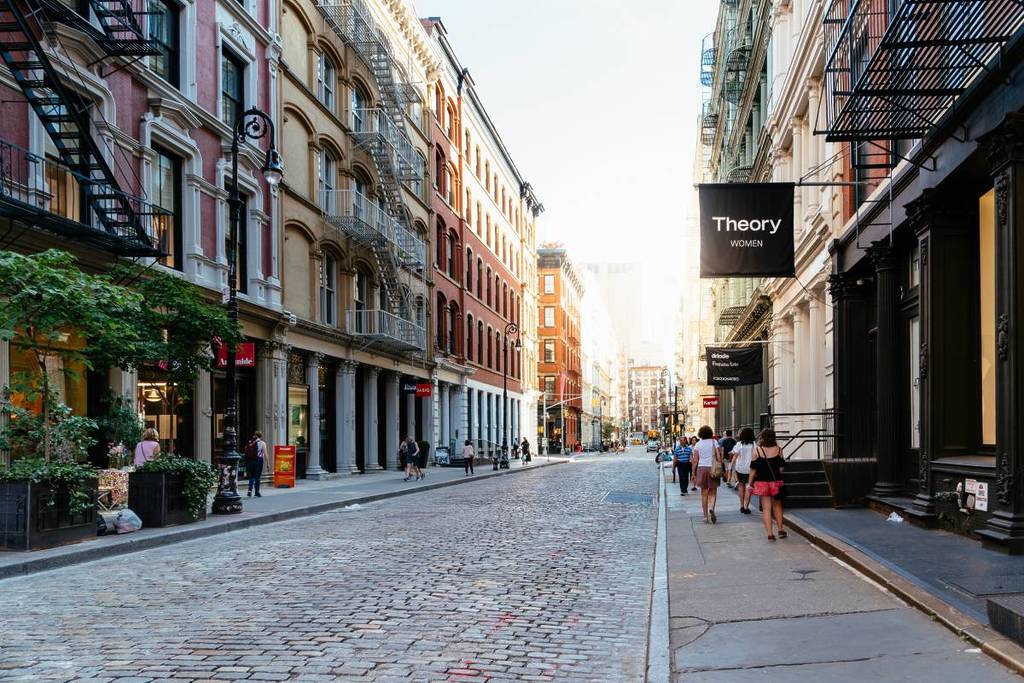 New York City, USA - June 25, 2018: Greene Street with luxury fashion retail stores in Soho Cast Iron historic District in New York City