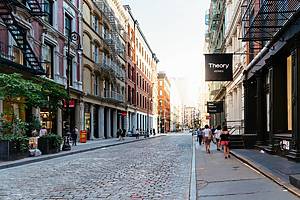 New York City, USA - June 25, 2018: Greene Street with luxury fashion retail stores in Soho Cast Iron historic District in New York City