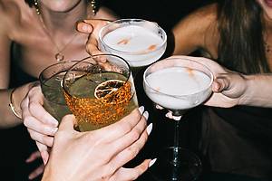 people holding drinks