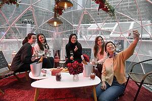 Rose-themed Cozy Igloos at Bank of America Winter Village at Bryant Park in New York City.