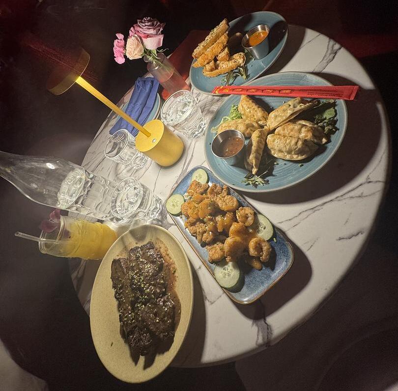 Tapas and drinks on table at Fernando's Hideaway in NYC