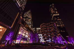 New York City, NY, USA - December 4, 2019. Winter night cityscape with the Vessel, part of the Hudson Yards Redevelopment Project in neighborhood on the West Side of Midtown Manhattan, New York, USA