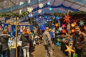 Bethlehem, PA, USA - December 9, 2018: Shoppers at the Christkindlmarket look for gifts. The Christmas market is held at Steel Stacks, a large campus that hosts festivals, concerts & events.<br />