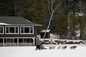 People enjoy dog sledding on Mirror Lake in Lake Placid, New York, on Friday, January 31, 2025.