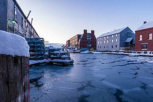 Portland, Maine / United States - Jan 20 2020: A winter sunrise on snowy and cold Portland Fish Pier.
