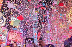 NEW YORK, N.Y. – January 1, 2023: Confetti falls in Times Square during a New Year’s celebration.