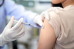 Close up of doctor making a vaccination in the shoulder of patient. coronavirus, Flu Vaccination Injection on Arm, covid-19 vaccine disease preparing for human clinical trials vaccination shot.