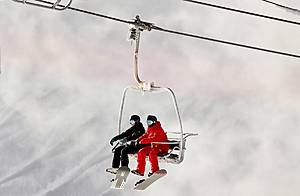 two people on a ski lift