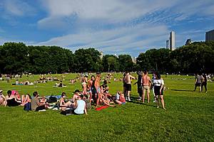 people gathering at Central Park on an hot summer saturday afternoon, in New York