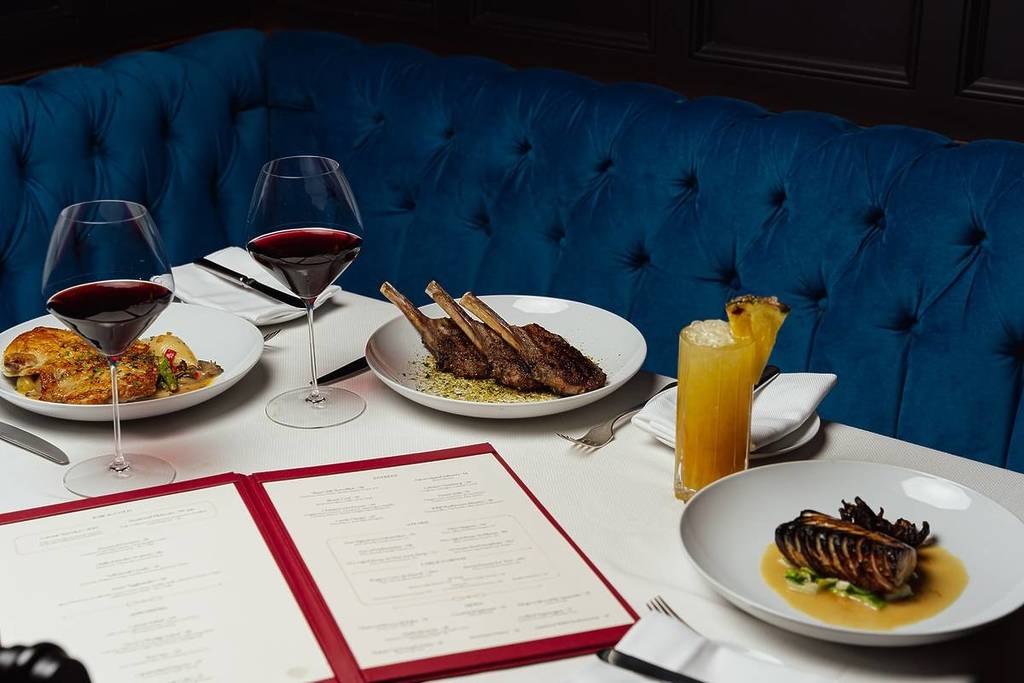 table of food and drinks at Delmonico's
