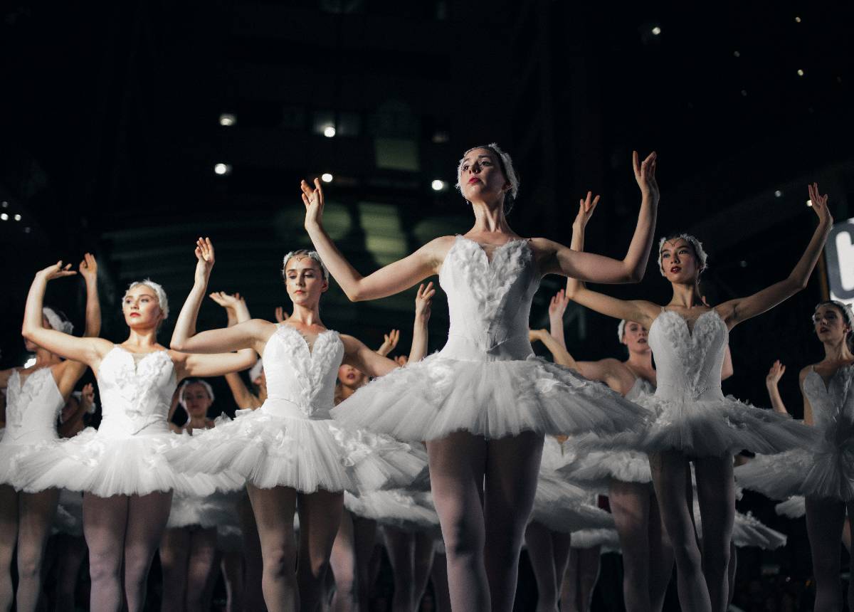 Ballerinas dressed for Swan Lake at a ballet show on stage