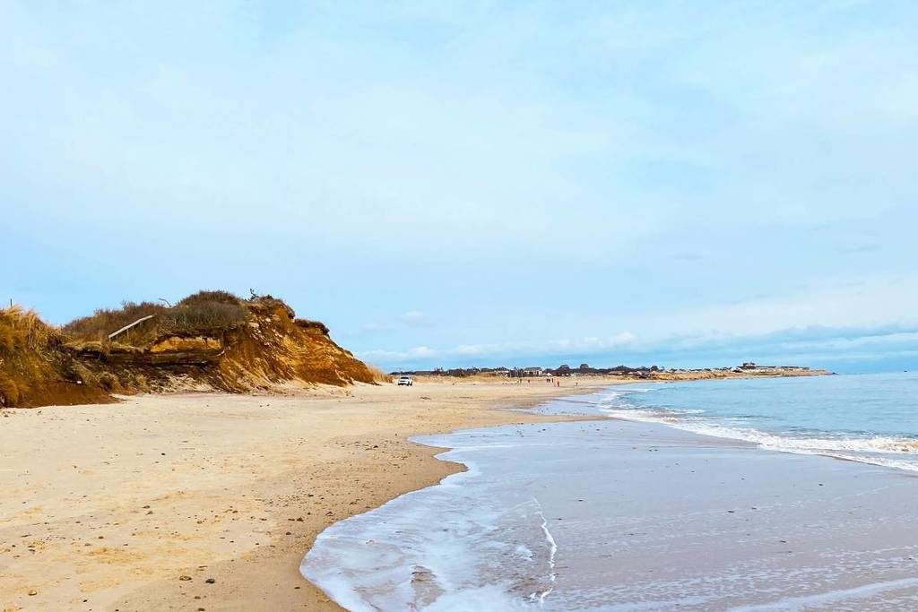 Montauk's sandy beach and coastline under a clear sky