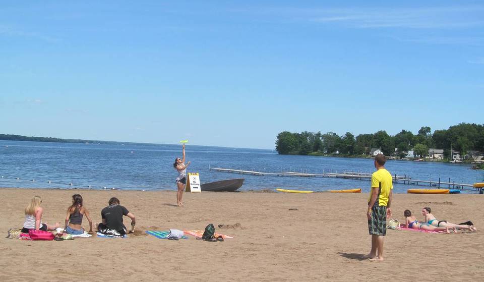 New York’s largest inland lake spans nearly 80 square miles — and its massive sandy beaches finally open this Saturday for Memorial Day weekend
