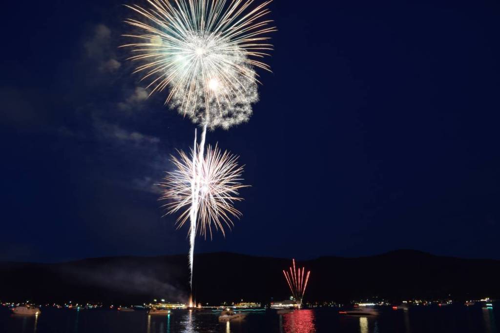 Fireworks on 4th of July lake george upstate New York. Colorful fireworks reflected on lake