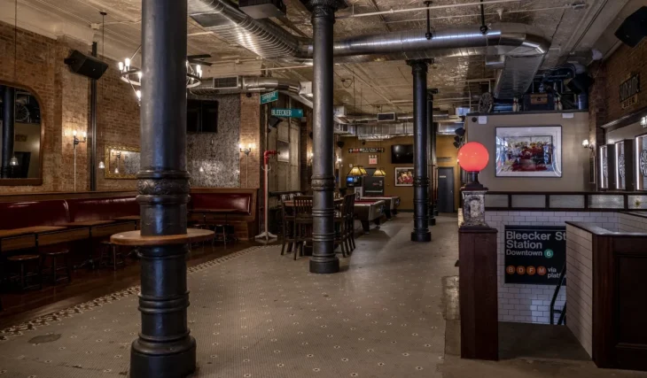 One of the oldest bars in NoHo is built from 140-year-old pieces of neighborhood history — including a massive bar and windows rescued from its original location