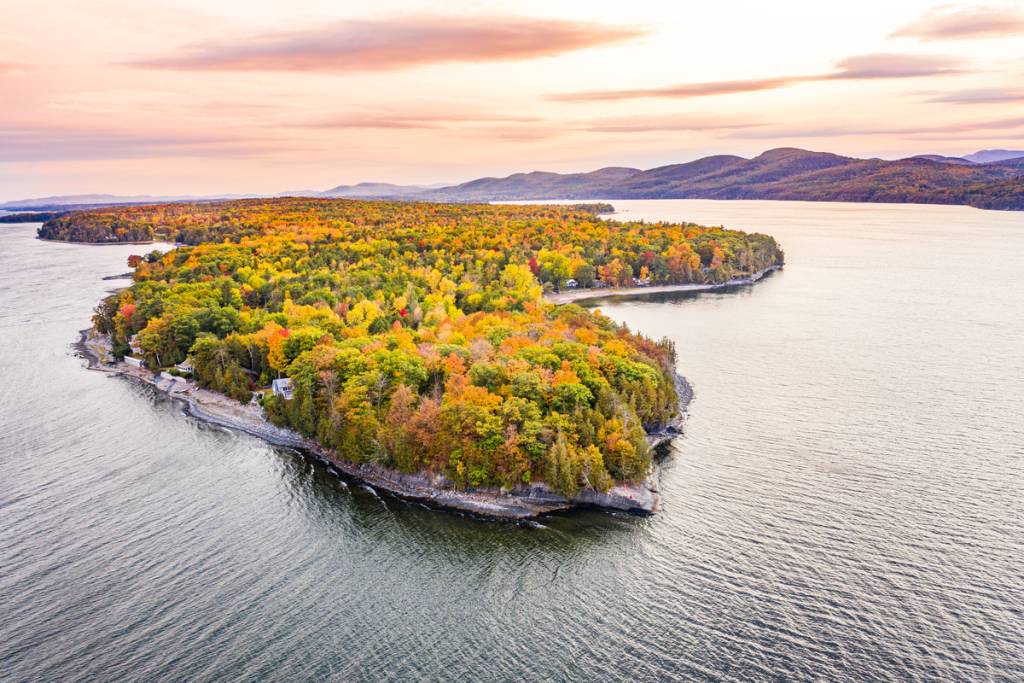 Known as the ‘Adirondack Coast,’ this 400-foot-deep New York  escape surrounded by fall colors hides wild forests, and a legendary underwater monster