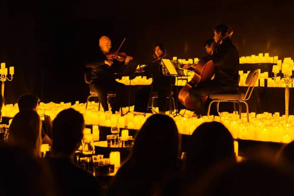 A string quartet performing on stage at Candlelight Wine