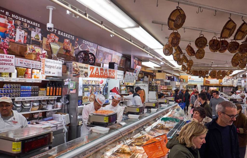 The fishmongers behind their desk at Zabar's speciality food store on Broadway