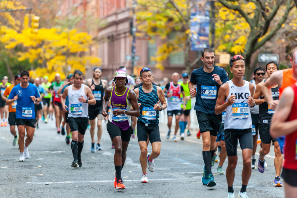 Runners pass through Harlem in New York near the 22 mile mark near Mount Morris Park in the running of the TCS New York City Marathon