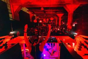 A giant Halloween rave is hitting Industry City in NYC this weekend – complete with multiple stages, dazzling light shows, and a stacked lineup of DJs