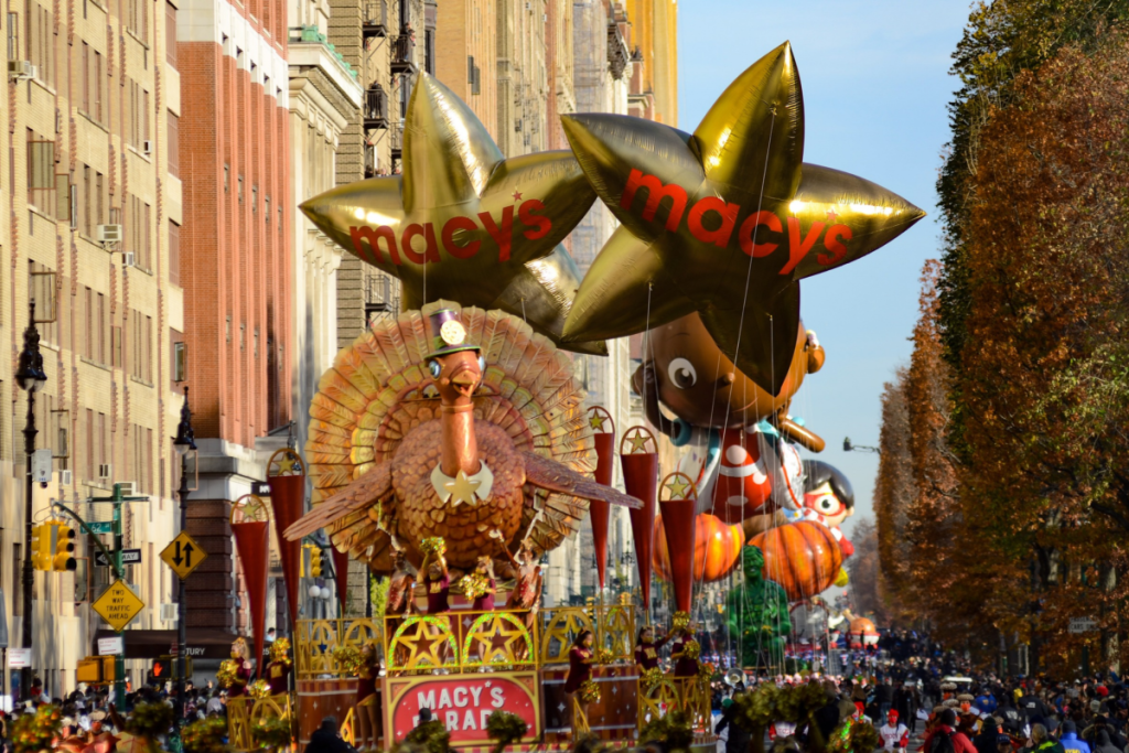 Performers and spectators seen enjoying the Macy's Thanksgiving Day Parade in New York City