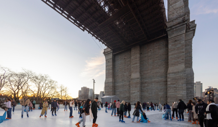This magical ice rink hidden underneath the Brooklyn Bridge returns this November with waterfront skyline views and free skate sessions