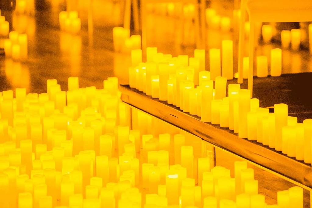 Thousands of candles scattered amongst the stage at a Candlelight concert
