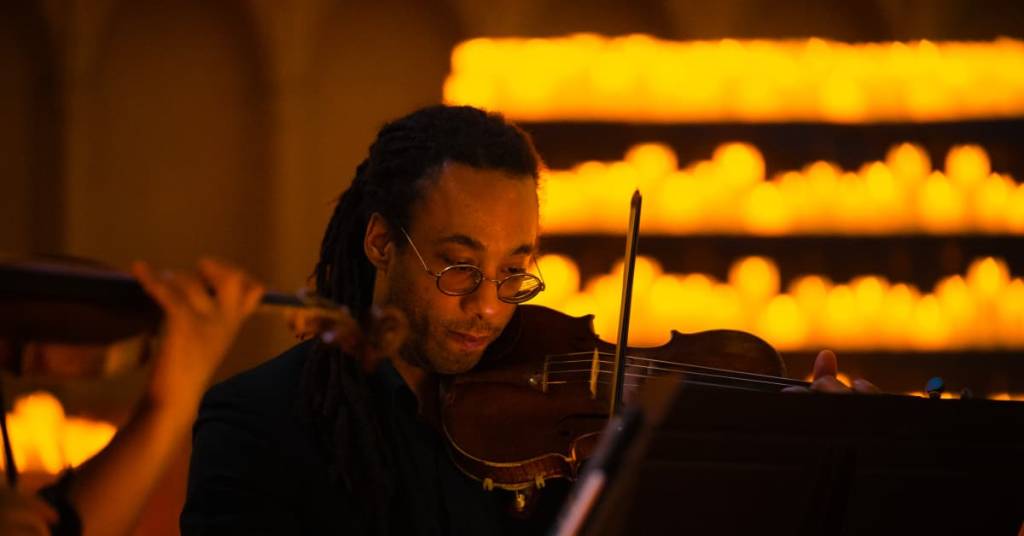 Close-up of a musician playing the violin at a Candlelight concert
