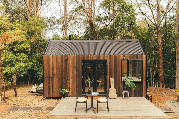 Wooden tiny house in the woods